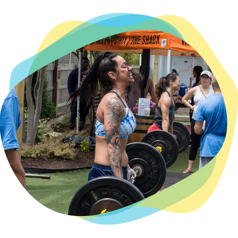 Two women clinking glasses during a roaring 20's party